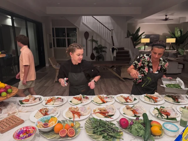 Chefs Kyra & Angel dancing their way through service tonight… because when the food’s made with joy, you can taste it.Final course: fresh mahi mahi en papillote on banana leaf with local Thai basil, citrus, white wine, and garlic. Served with confit garlic mashed potatoes, roasted baby carrots, asparagus, and cauliflower.We love what we do, and we love feeding you.Mahalo to @okisseafood for the fresh fish, @okoafarms  for the beautiful local produce, and @pauwela_produce for our final touches of micros & edible flowers. We appreciate you all 🫶🏻#LotusChefs #MauiPrivateChef #PrivateChefMaui #MauiFineDining #FarmToTableWithAloha #EnPapillote #MahiMahi #WomenInFood #JoyfulCuisine
